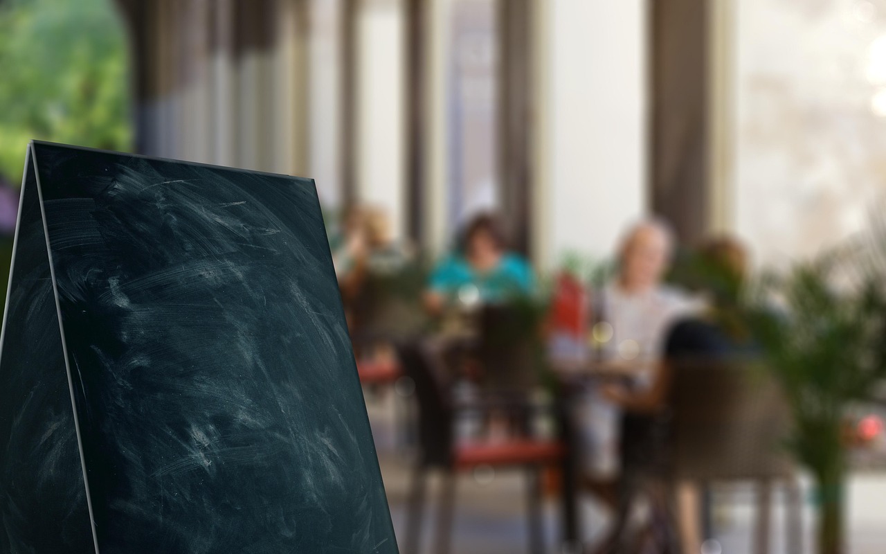 Small chalkboard food labels on a party table
